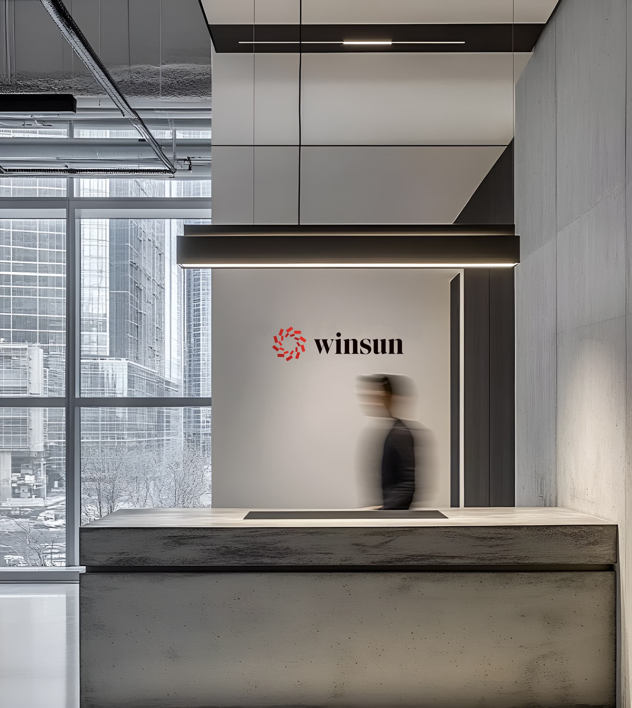 WINSUN logo on the reception wall of a corporate lobby