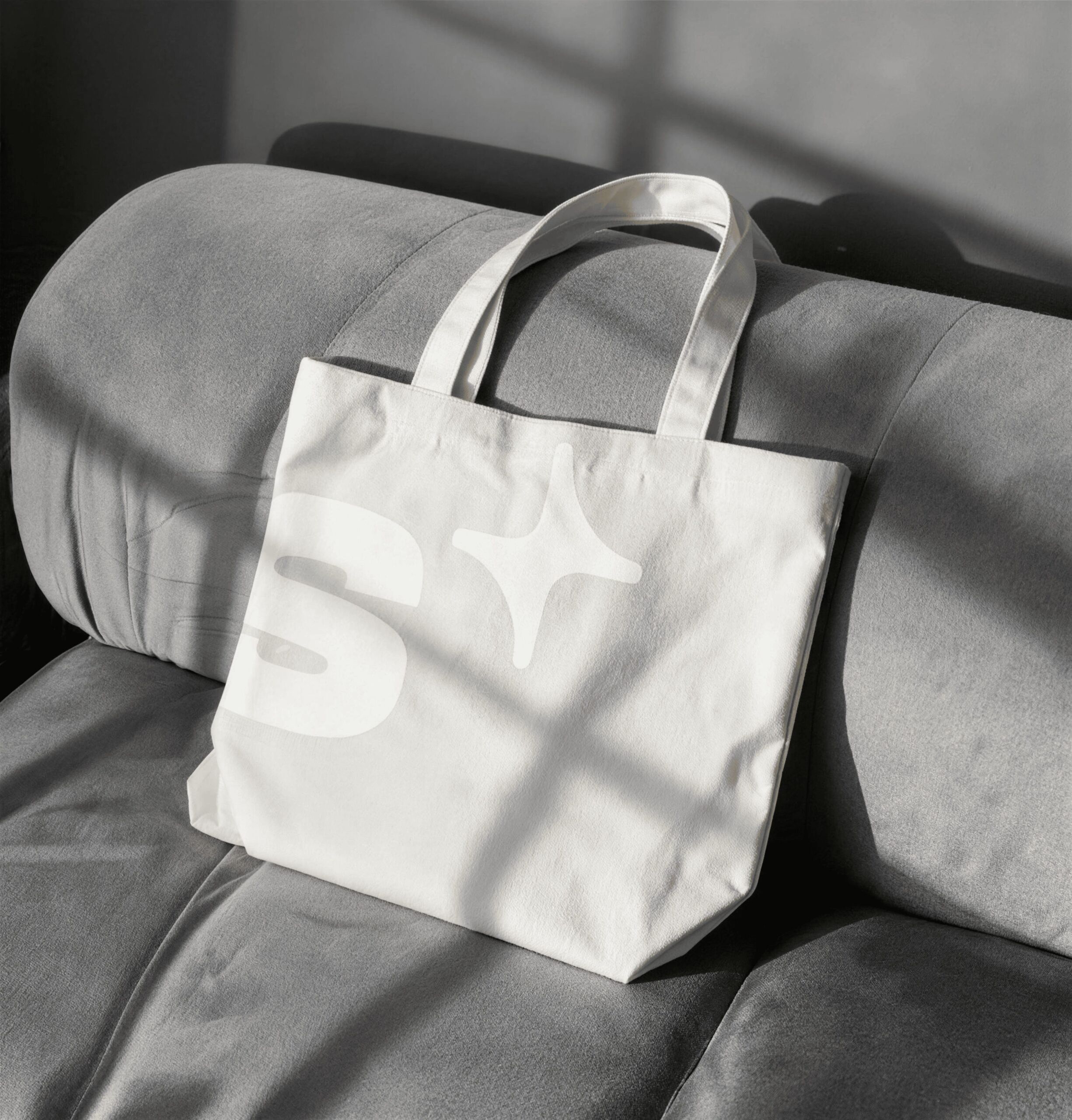 White tote bag with the S+ symbol